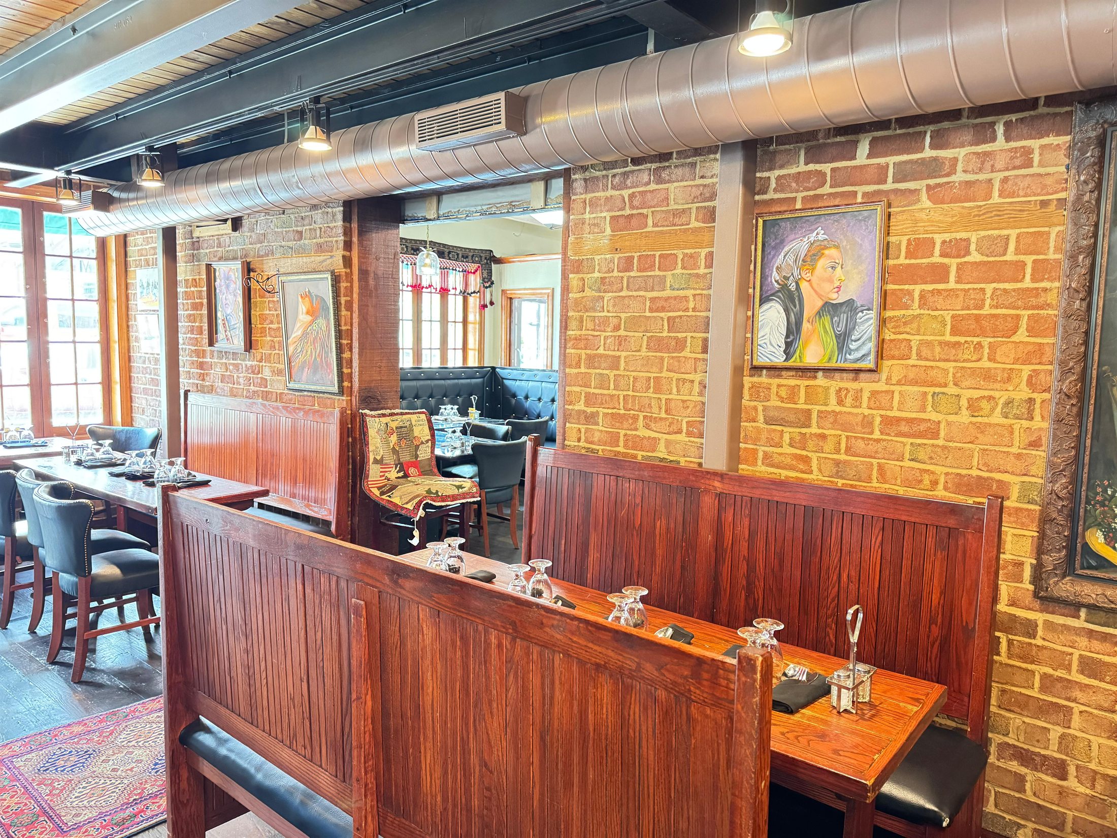 Afghan Kabob House family booth seating and warm wood dining room